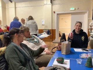 Lyn,  Sharon and Sophie showing off their Christmas decorations